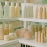 A selection of affordable drugstore skincare and makeup products arranged on a shelf